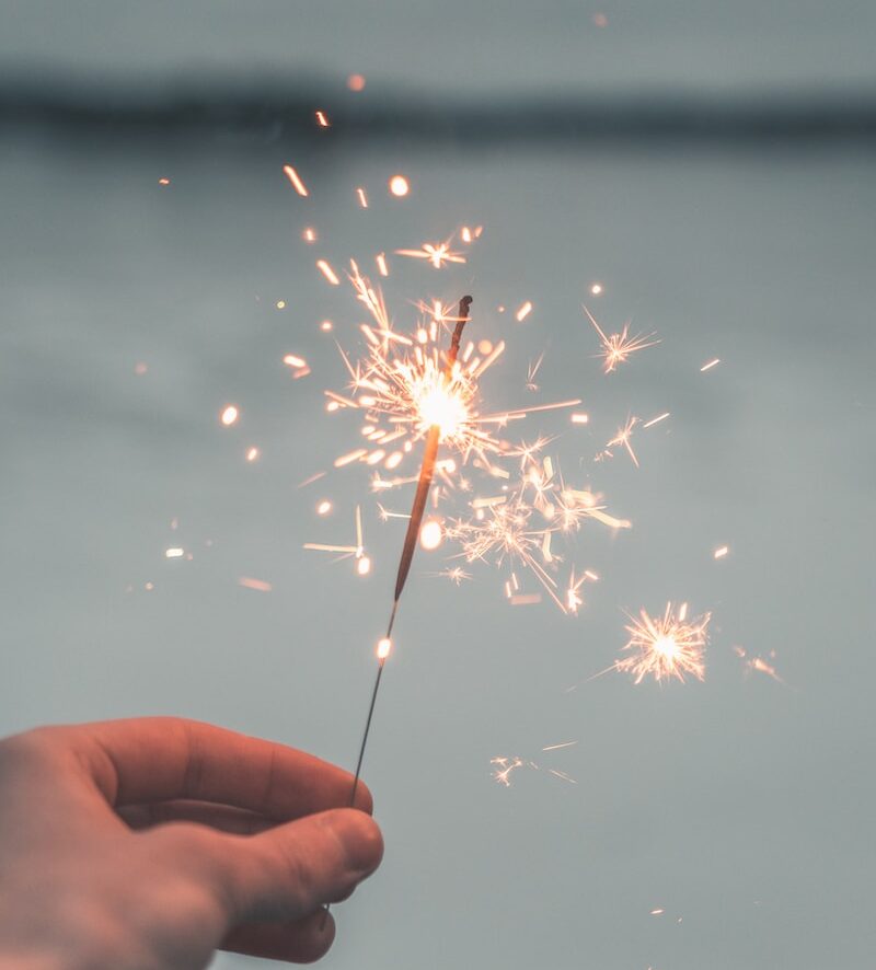 person holding sparkler